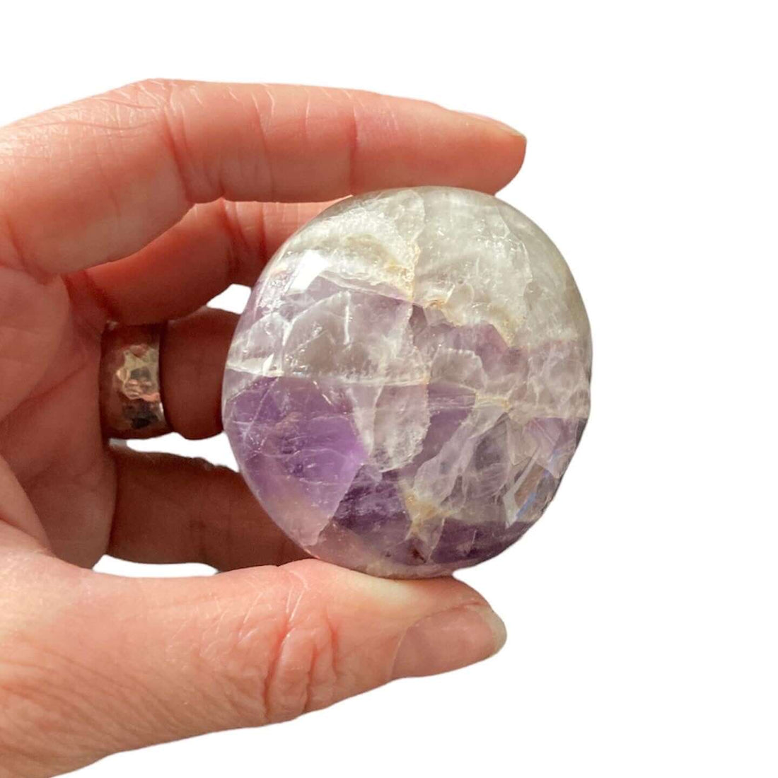 Evermore Everlasting amethyst palm stone showing polished purple gemstone with natural crystal patterns and smooth rounded edges.