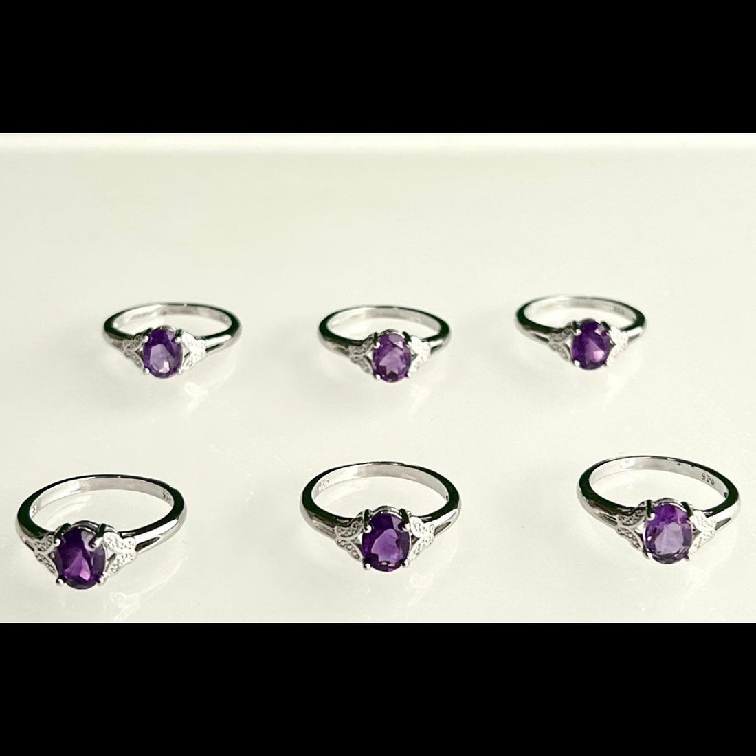 Evermore Everlasting amethyst ring featuring a polished purple gemstone set in a silver band, close-up view of the jewelry.