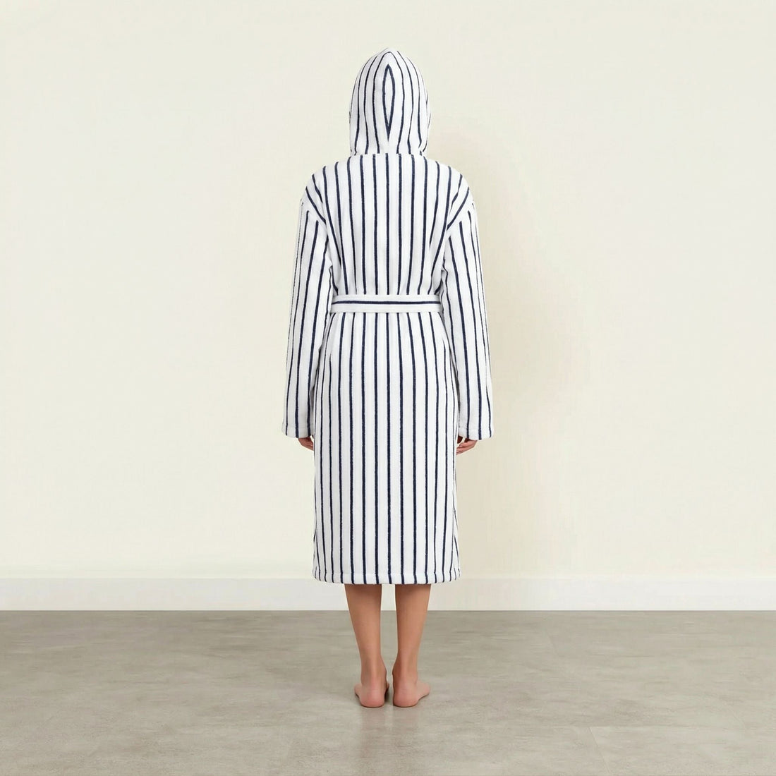 Unisex navy striped Ultraplush Australian cotton bathrobe from Italic, shown hanging with a plush collar and tied waist.