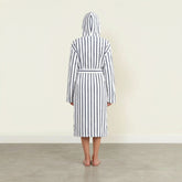 Unisex navy striped Ultraplush Australian cotton bathrobe from Italic, shown hanging with a plush collar and tied waist.