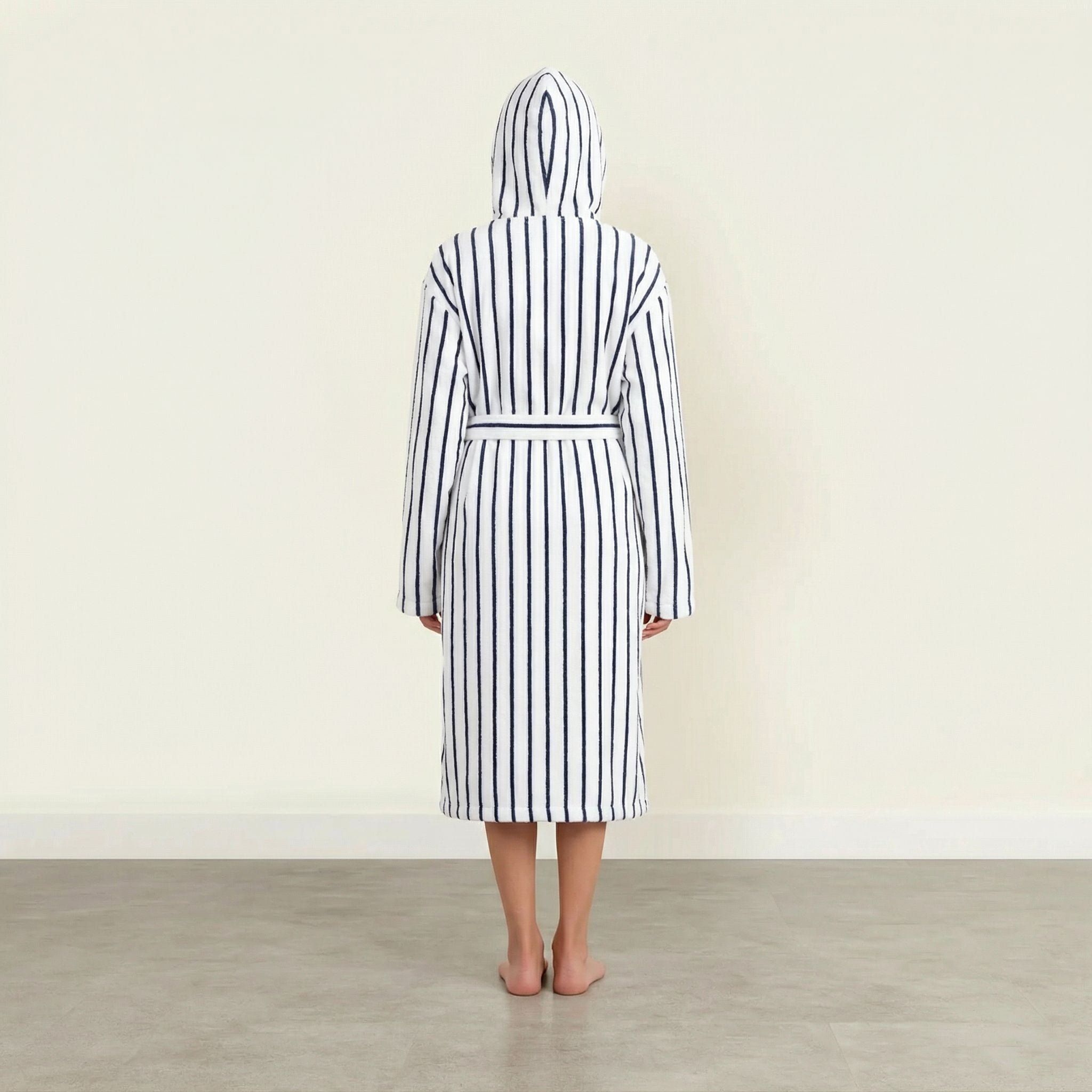 Unisex navy striped Ultraplush Australian cotton bathrobe from Italic, shown hanging with a plush collar and tied waist.