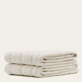 Blue Capri Australian Cotton Bath Towel from Italic, soft and plush, draped on a bathroom hook for home bath use.
