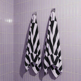 Italic Shadmoor Australian Cotton bath towel draped over a surface, showcasing soft, plush texture and elegant design.