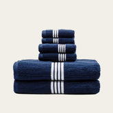 Set of Nautilus Australian Cotton Bath Towels by Italic, plush white towels with a textured weave for luxurious home use.