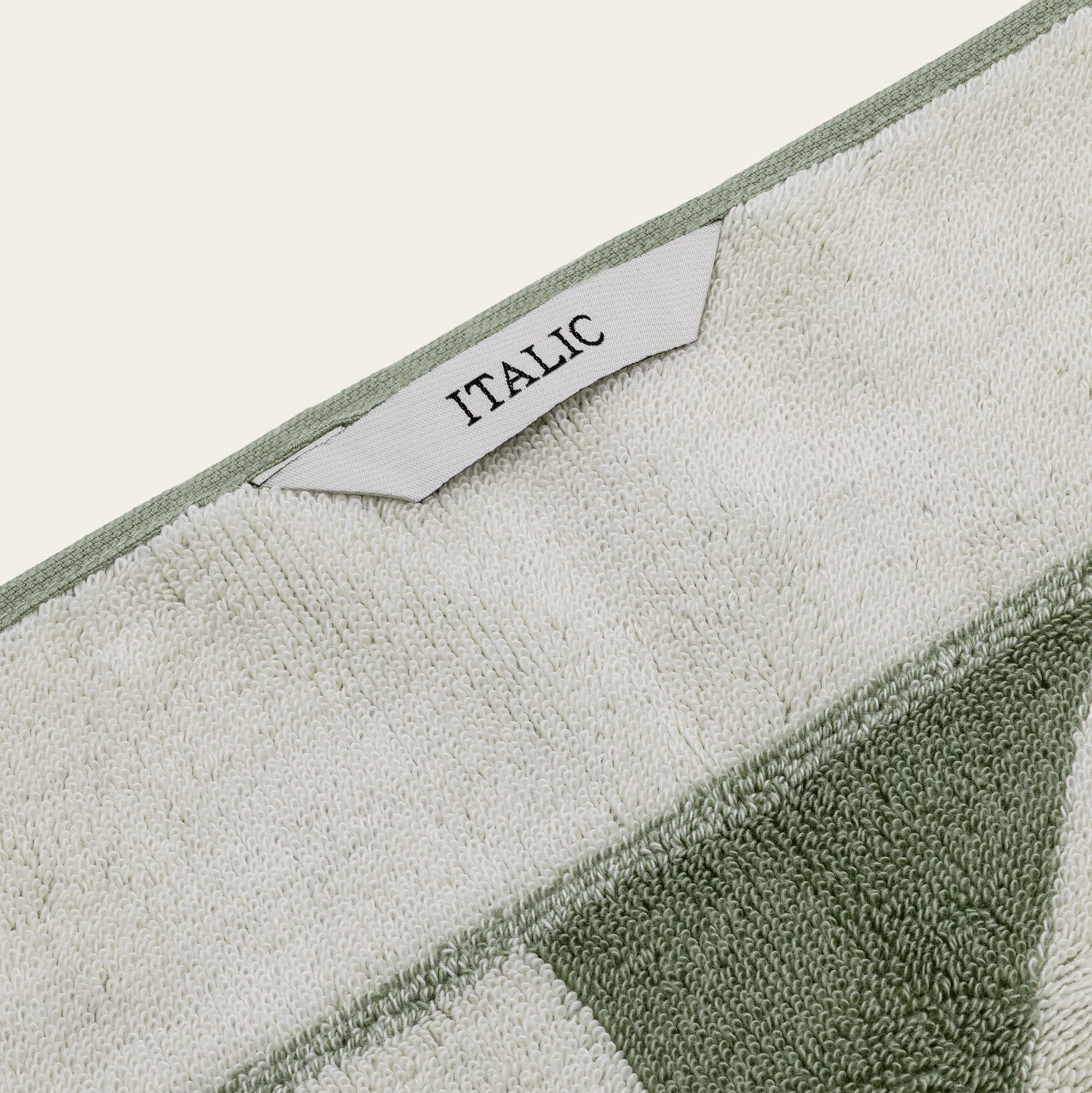 Italic Umbra Australian Cotton Bath Towel with plush texture and white color, displayed folded on a clean bathroom surface.
