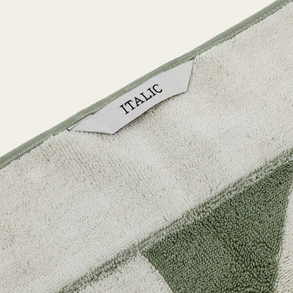 Italic Umbra Australian Cotton Bath Towel with plush texture and white color, displayed folded on a clean bathroom surface.