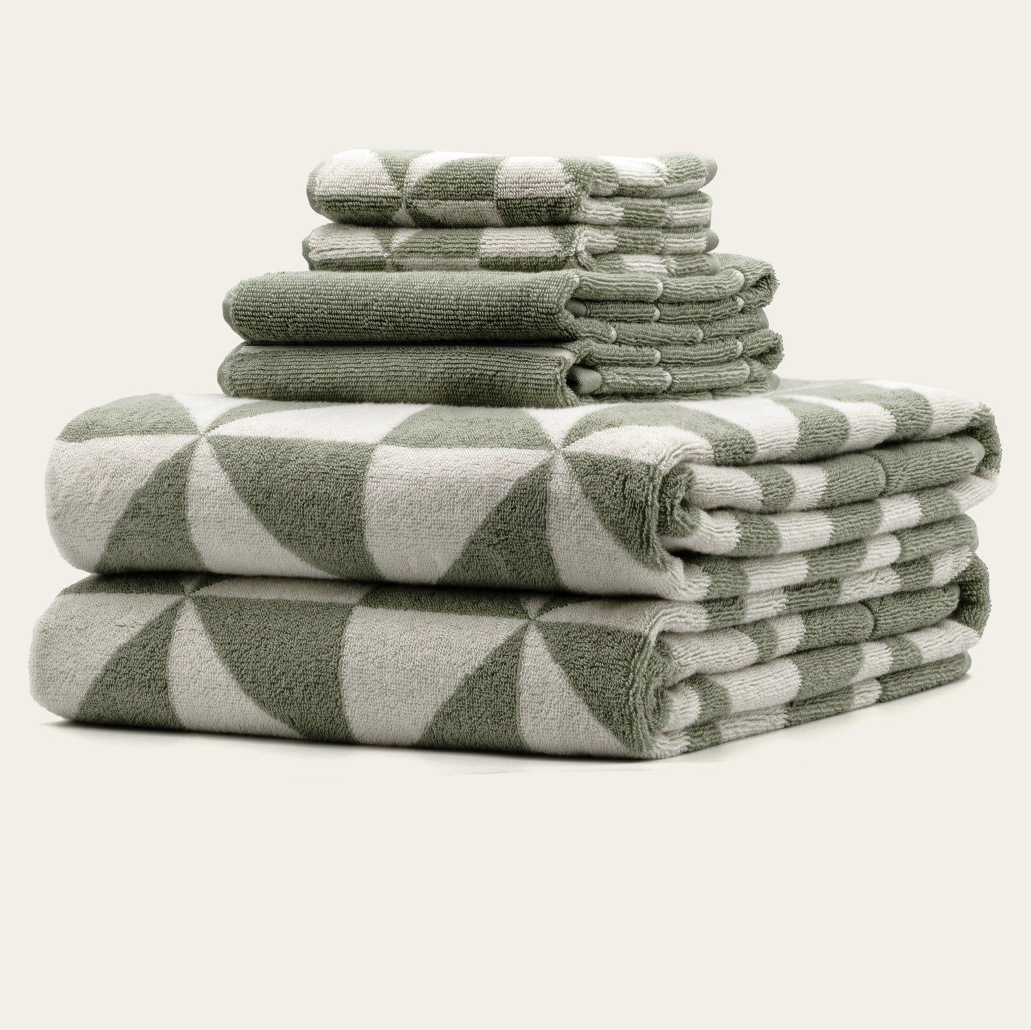 Set of Umbra Australian Cotton Bath Towels by Italic featuring plush, white, luxurious towels hanging on a towel rack.