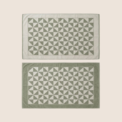 Umbra Australian cotton bath towels by Italic, flatlay image showing soft, plush, white towels perfect for bathroom use.