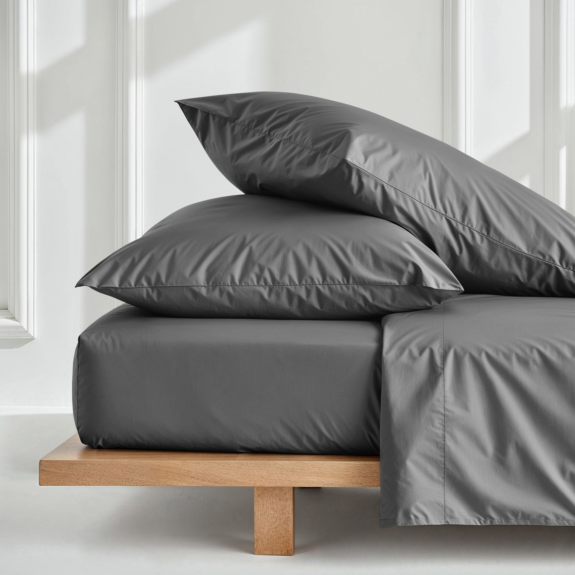 Set of two Luxe Australian Sateen pillowcases from Italic, soft and smooth bed pillow covers in a neutral color.