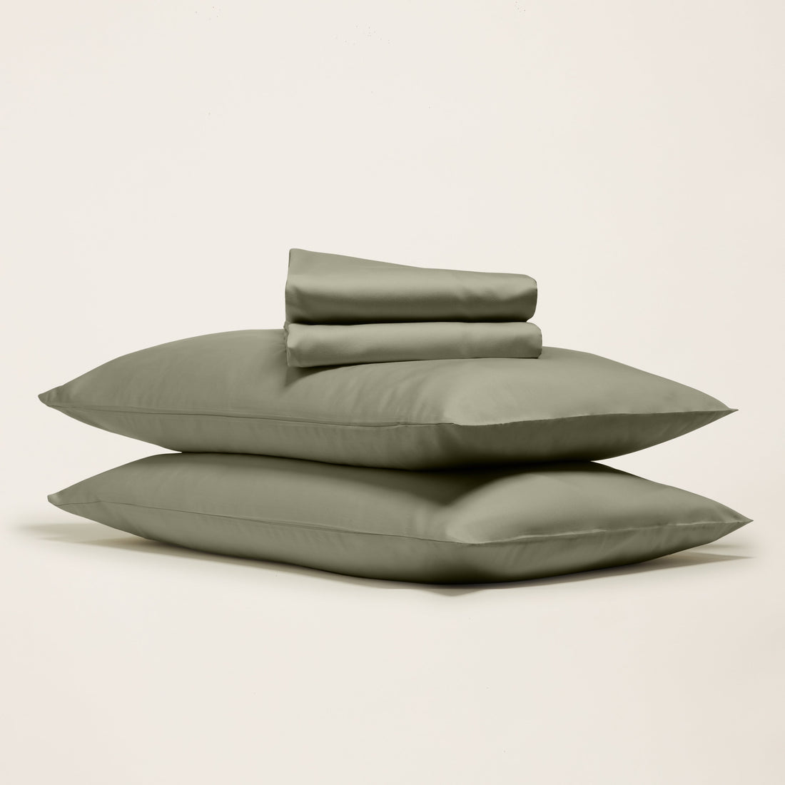 Smooth Luxe Australian Sateen Sheet Set by Italic shown on a neatly made bed with white satin sheets and matching pillowcases.