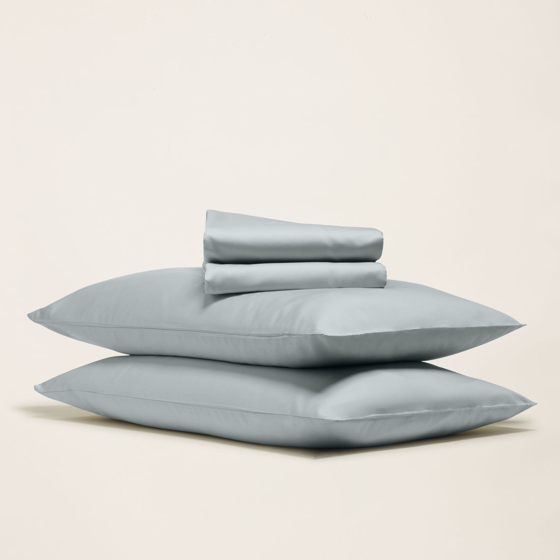Luxe Australian Sateen Sheet Set by Italic, soft and smooth bed sheets with a neatly made bed and white pillowcases.