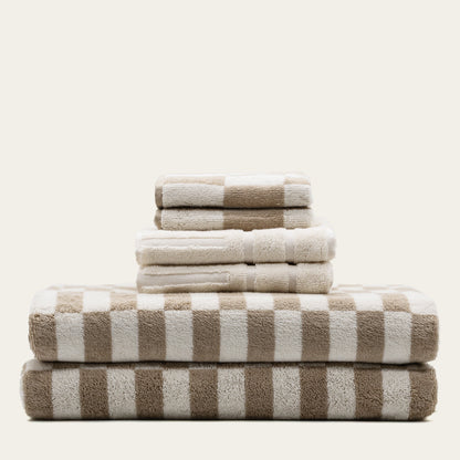 Luxurious Pietra Australian Cotton Towel by Italic, showing soft, plush white towel with textured weave and folded design.