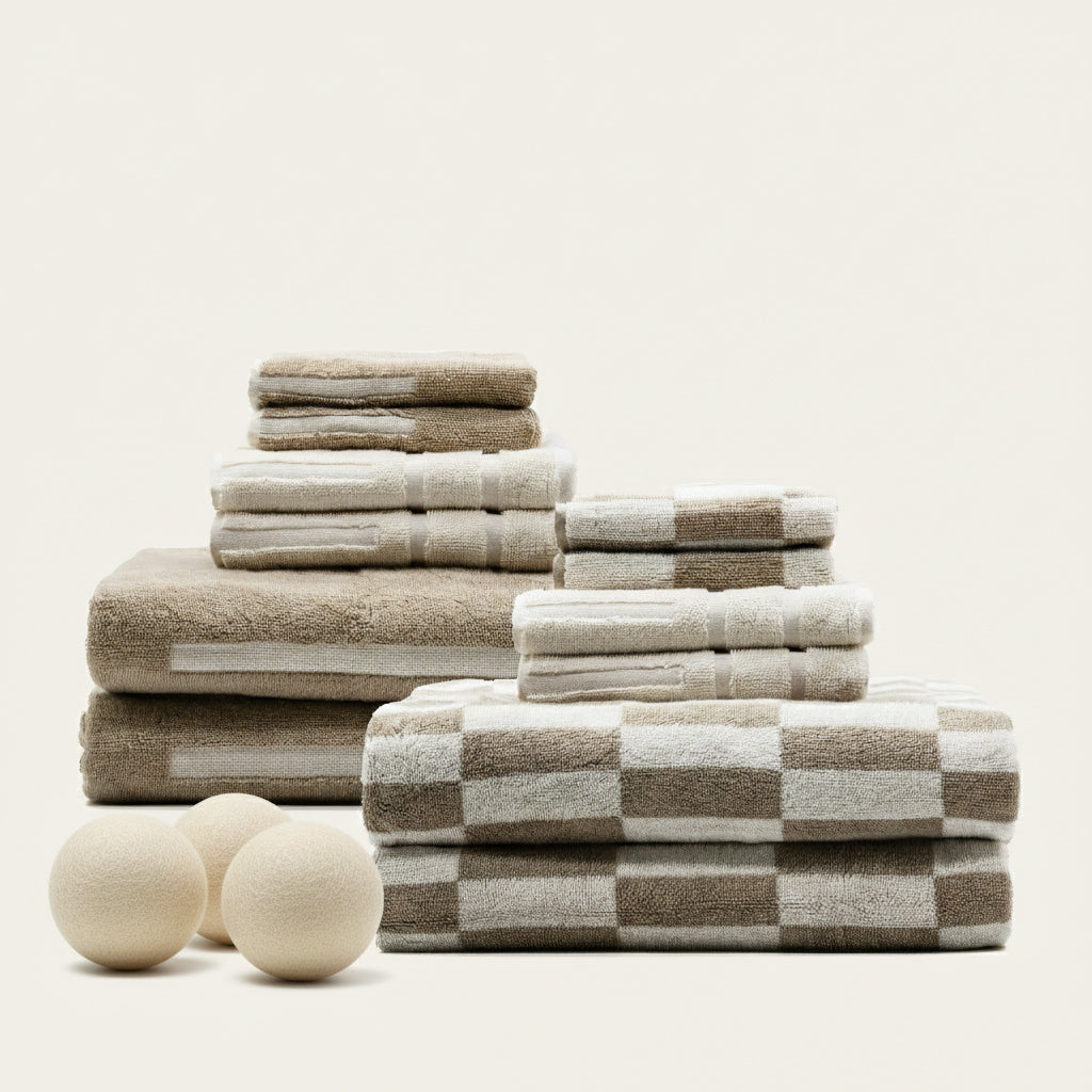 Set of Pietra Australian cotton towels in soft, neutral tones, featuring a textured weave, ideal for bathroom or guest use.