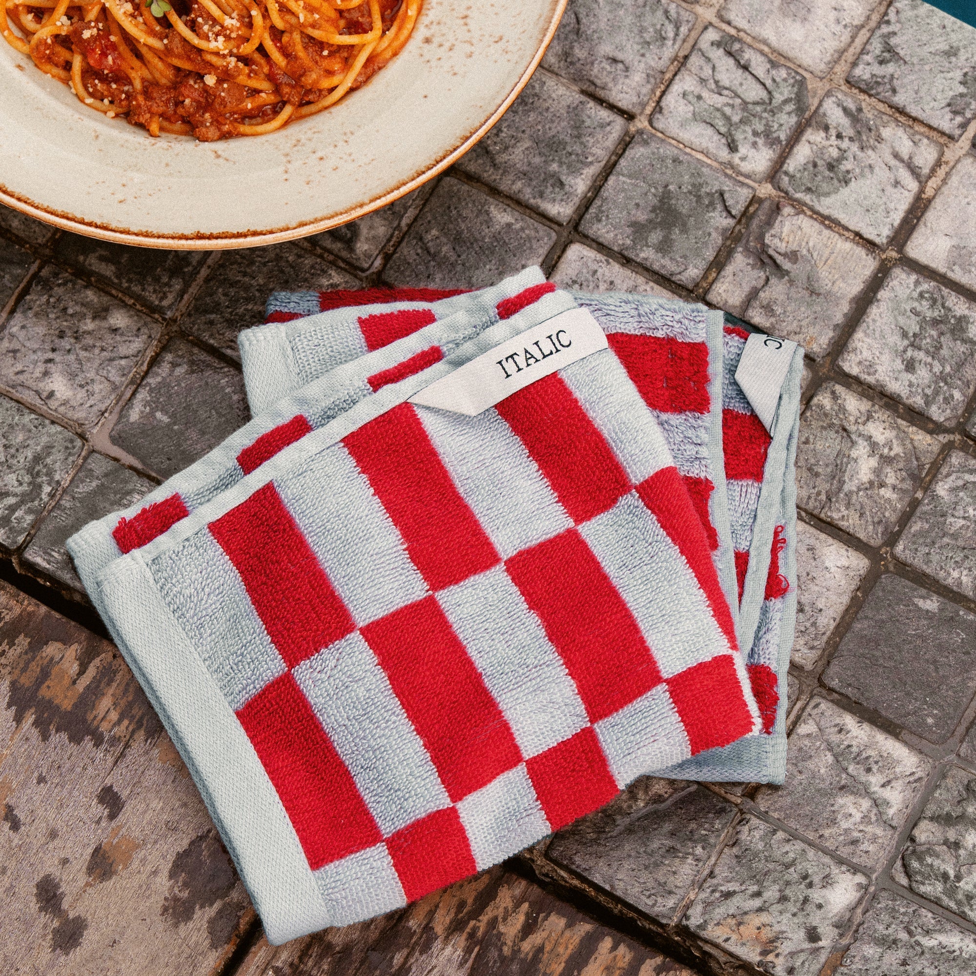 Orange Pietra Australian cotton washcloth from Italic with a soft, textured surface for gentle skincare.