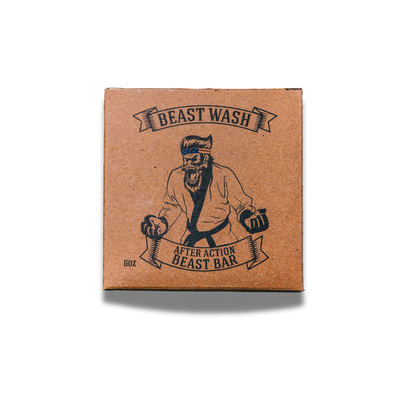Johnny Slicks After Action Beast Bar soap showing a natural, rustic soap bar with a textured surface and branding label.