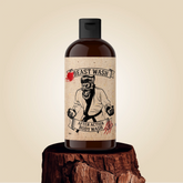 Johnny Slicks After Action Body Wash bottle with label, featuring a sleek design and natural ingredients on a white background.