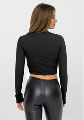 Black leather-look crossover flare leggings from Fitkitty Culture Athleisure Wear, showcasing their stylish, fitted design.