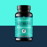 Key Nutrients electrolyte hydration pills in capsule form, showing a close-up of the supplement bottles and capsules.