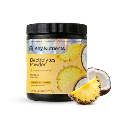 Pineapple and coconut flavored Key Nutrients Electrolyte Recovery Plus Powder in a sugar-free formula with a scoop and open packet.