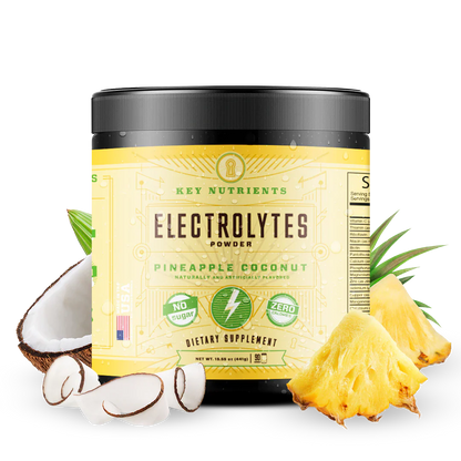 Key Nutrients electrolyte recovery powder in pineapple coconut flavor, sugar-free electrolyte mix with citrus and tropical fruit visuals.