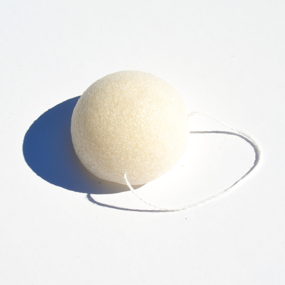 Pretty Farm Girl konjac face sponge showing its soft, rounded texture and natural fibers for gentle facial cleansing.