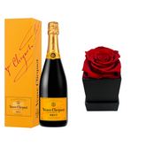 Veuve Clicquot Brut champagne gift set with a single flower, featuring a bottle of Veuve Clicquot Brut and a decorative flower.
