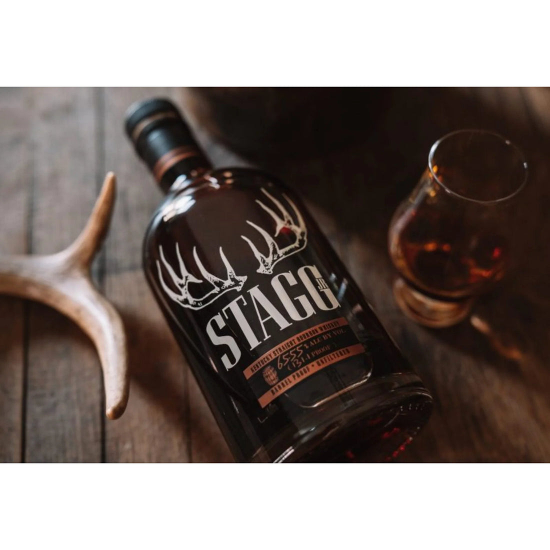 George T. Stagg Jr. Kentucky Straight Bourbon Whiskey bottle with label, 750ml, Liquor Geeks branding, dark glass bottle, and whiskey inside.