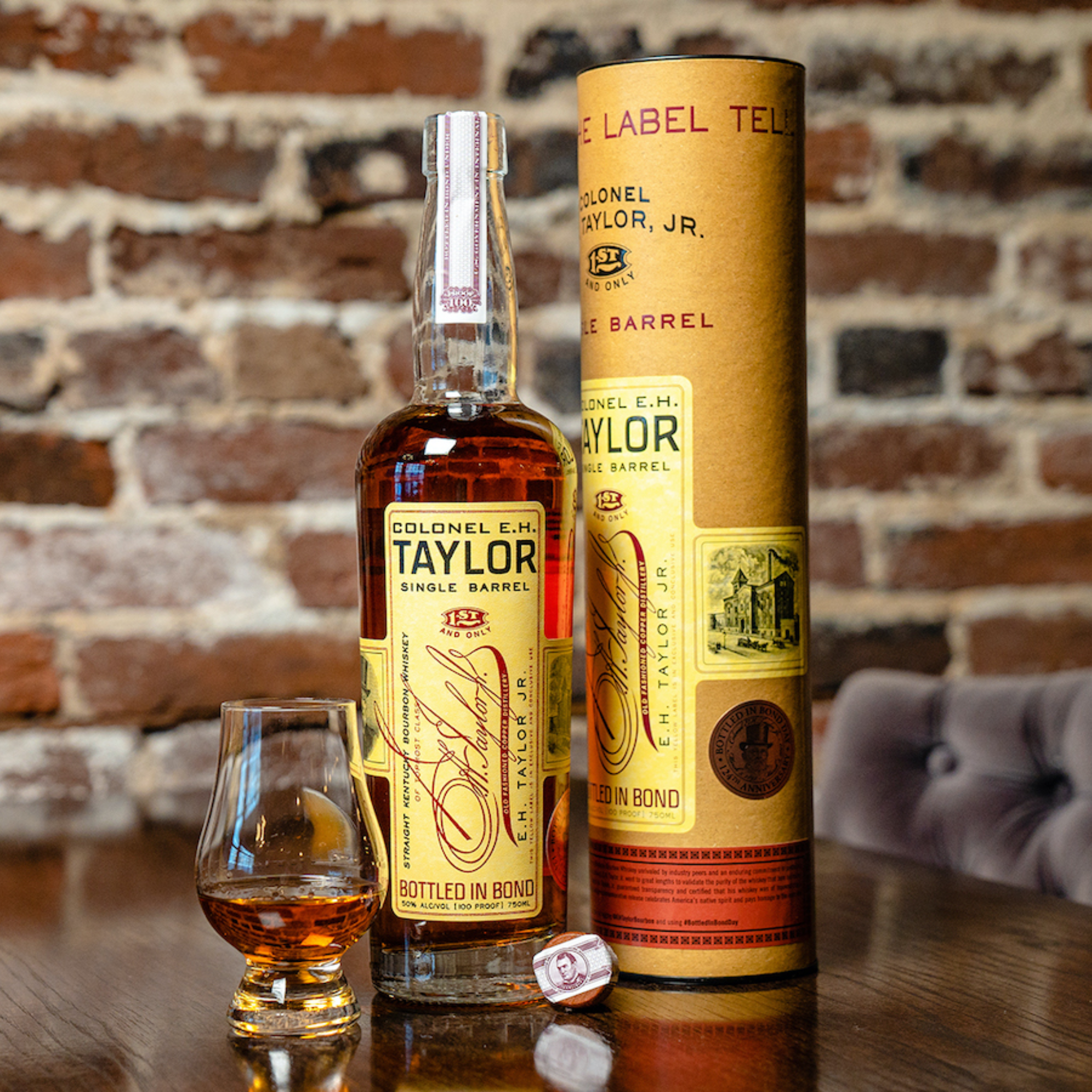 Bottle of Colonel E.H. Taylor Single Barrel Bourbon Whiskey from Liquor Geeks, 750 ml with a classic label and amber liquid inside.