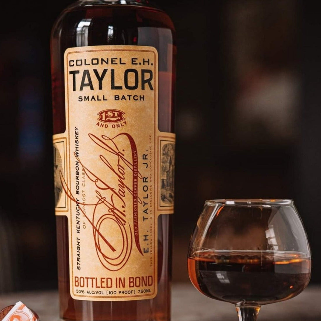 Bottle of Colonel E.H. Taylor Small Batch Bourbon Whiskey with label visible, 750ml size, from Liquor Geeks.