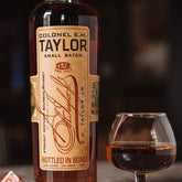 Bottle of Colonel E.H. Taylor Small Batch Bourbon Whiskey with label visible, 750ml size, from Liquor Geeks.