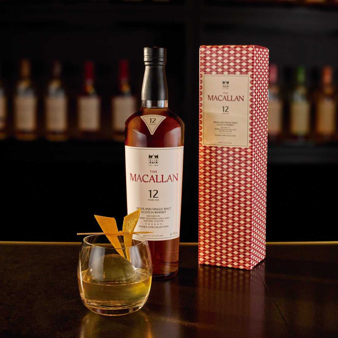 A 750ml bottle of The Macallan 12 Year Old Double Cask Single Malt Scotch Whiskey, with a dark brown label and elegant packaging.