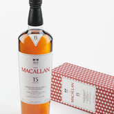 Bottle of The Macallan Double Cask 15 Years Old Single Malt Scotch Whiskey, 750ml, with a dark amber liquid in a branded bottle.