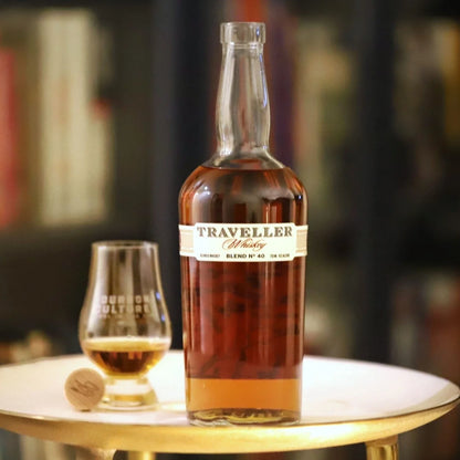 Bottle of Traveller Blend No. 40 Whiskey by Chris Stapleton and Buffalo Trace, 750ml, with a clear label and amber liquid inside.