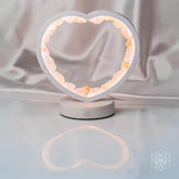 Rose quartz heart lamp night light by Conscious Items featuring a love magnet design and soft glowing illumination.