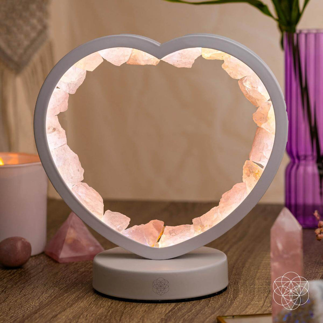 Rose quartz heart-shaped night light from Love Magnet by Conscious Items, showcasing a soft glowing pink lamp with a heart design.