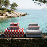 White Pietra Australian cotton towels by Italic, showcasing soft, plush fabric with a textured weave pattern.