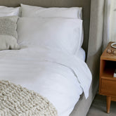 White Luxe Australian Sateen Sheet Set by Italic, soft and smooth bed sheets on a neatly made bed.