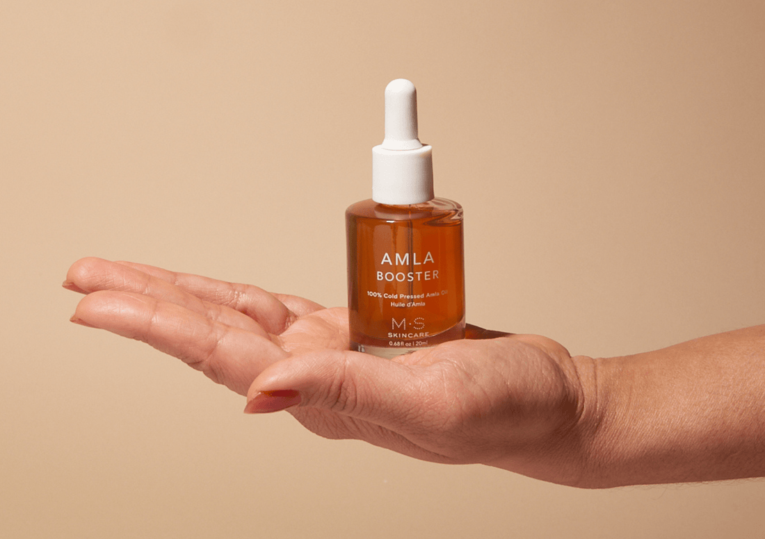 M.S Skincare Amla Oil bottle, Ayurvedic herbal oil for hair and skin, with natural amber-colored liquid in a clear glass bottle.