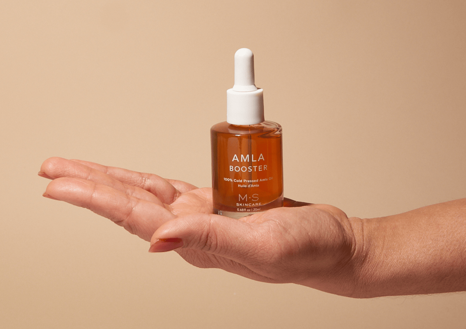 M.S Skincare Amla Oil bottle, Ayurvedic herbal oil for hair and skin, with natural amber-colored liquid in a clear glass bottle.