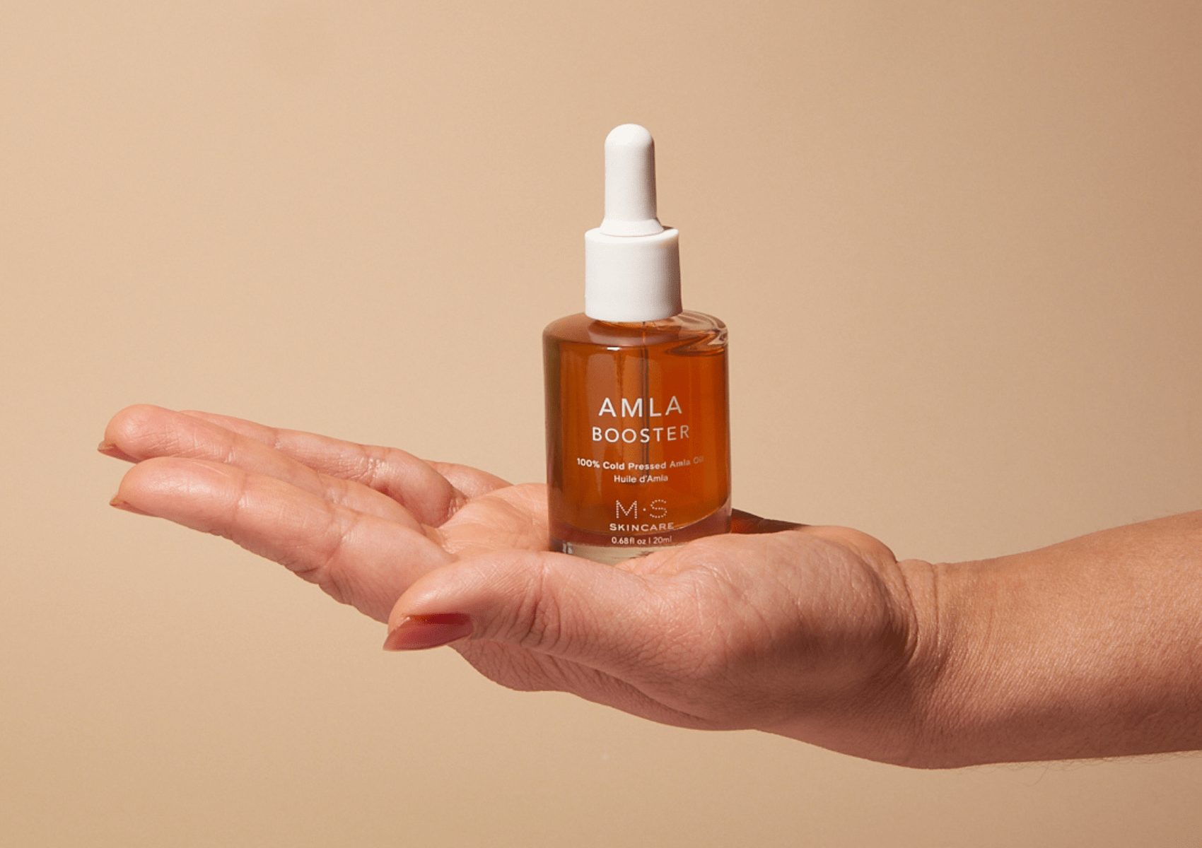M.S Skincare Amla Oil bottle, Ayurvedic herbal oil for hair and skin, with natural amber-colored liquid in a clear glass bottle.