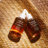 M.S Skincare Amla Oil bottle, Ayurvedic oil for hair and skin, with a dark amber liquid in a clear glass bottle