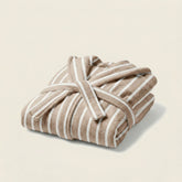 Unisex Ultraplush Australian cotton bathrobe by Italic, soft white fabric with a cozy collar and waist tie, displayed on a hanger.