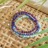 Set of four manifestation magnet jewelry pieces by Conscious Items, featuring spiritual and positive energy symbols.