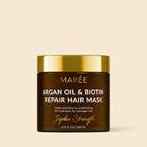 Maree Argan Oil & Biotin Hair Repair Mask with jojoba for nourishing and strengthening damaged hair, shown in a sleek jar.