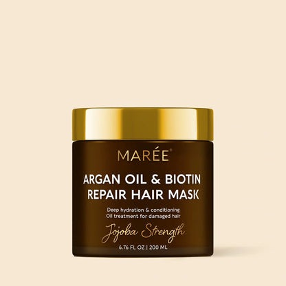 Maree Argan Oil &amp; Biotin Hair Repair Mask with jojoba for nourishing and strengthening damaged hair, shown in a sleek jar.