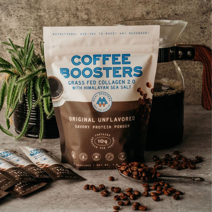 Unflavored collagen and electrolyte coffee boosters mixed into brewed coffee, enhancing flavor and health benefits.