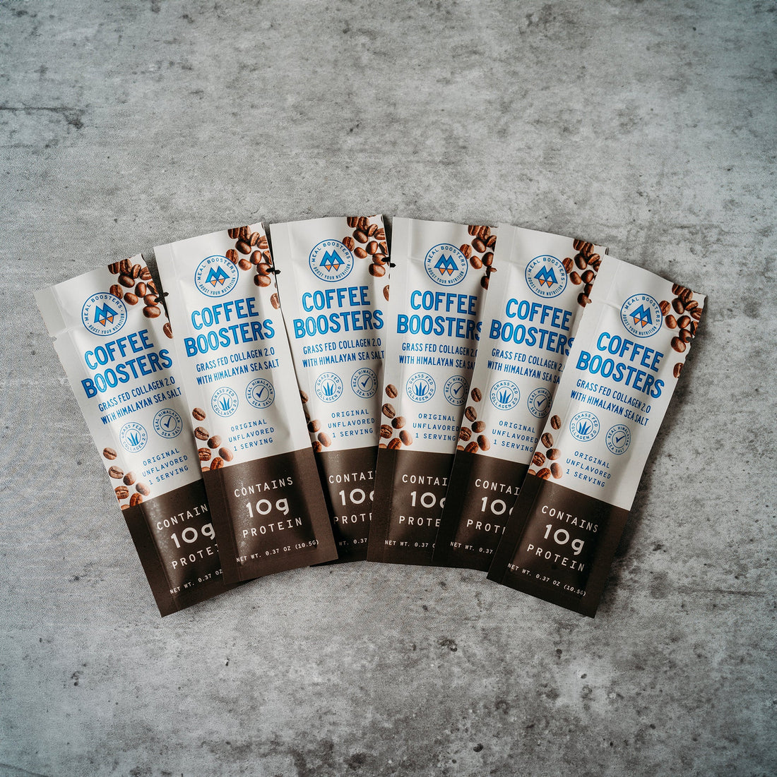Unflavored collagen and electrolyte coffee booster packs from Meal Boosters, six single-serving sachets for added energy and hydration.