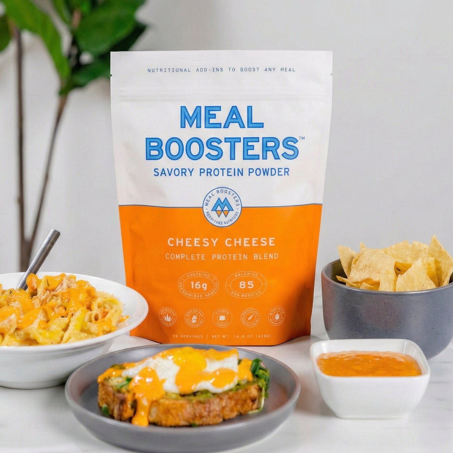 Cheesy Cheese Collagen+ Protein Blend protein powder scoop with powder in a jar, showing the Meal Boosters brand.