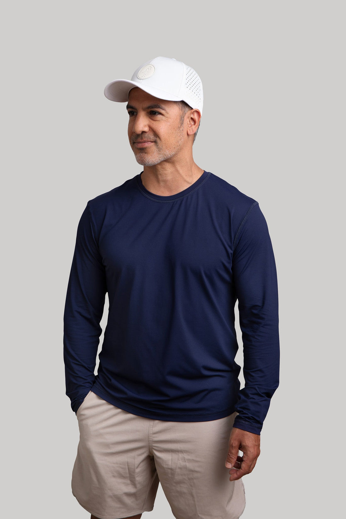 Navy JOJU Performance UV Protective Sport Cap worn by a model, showcasing breathable fabric and sporty design for outdoor activities.