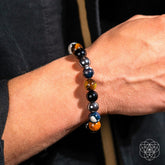 Conscious Items Orca’s Armor triple protection and healing bracelet featuring black and silver beads with a silver whale charm.